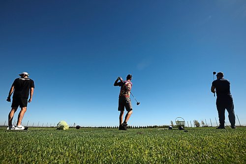 25092024
Kelvin Pople, Derek Smart and Alex Borges practice their swings at Mulligan's Driving Range &amp; Practice Centre along Highway 1A just outside Brandon on a beautiful late September Wednesday.
(Tim Smith/The Brandon Sun)