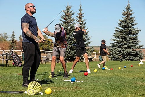 25092024
Alex Borges, Derek Smart, Kelvin Pople and Don Ariss practice their swings at Mulligan's Driving Range &amp; Practice Centre along Highway 1A just outside Brandon on a beautiful late September Wednesday.
(Tim Smith/The Brandon Sun)