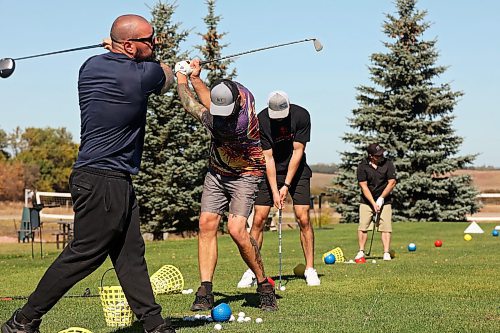 25092024
Alex Borges, Derek Smart, Kelvin Pople and Don Ariss practice their swings at Mulligan's Driving Range &amp; Practice Centre along Highway 1A just outside Brandon on a beautiful late September Wednesday.
(Tim Smith/The Brandon Sun)