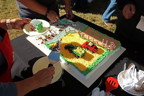 05092024
Cake is cut during the fourth annual Acres for Hamiota community harvest west of Hamiota on a sunny Tuesday. Acres for Hamiota raises money for community projects and organizations and this year all the machinery for the harvest was operated by women to highlight the important role women play in agriculture. The harvest was preceded by a picnic lunch.
Tim Smith/The Brandon Sun) 