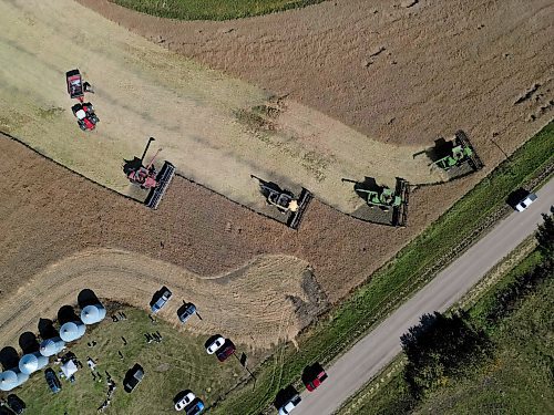 05092024
Four combines and a grain cart work to harvest 125 acres of canola near Oakden, Manitoba as part of the fourth annual Acres for Hamiota community harvest west of Hamiota on a sunny Tuesday. Acres for Hamiota raises money for community projects and organizations and this year all the machinery for the harvest was operated by women to highlight the important role women play in agriculture. The harvest was preceded by a picnic lunch.
Tim Smith/The Brandon Sun)