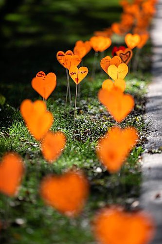 MIKAELA MACKENZIE / FREE PRESS
	
The orange heart walkway project at cole Van Walleghem School Thursday, Sept. 26, 2024. 

For Maggie story.
Winnipeg Free Press 2024