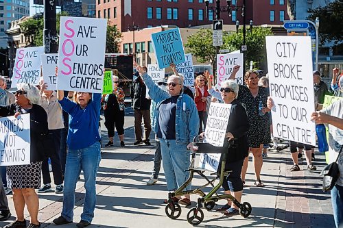 MIKE DEAL / FREE PRESS
A group of seniors rally outside City Hall chanting and waving signs to cars driving by on Main Street, to support Seniors Centres in Winnipeg and to draw attention to the fight for Good Neighbours Active Living Centre&#x2019;s building management rights Thursday morning.
Reporter: Nicole Buffie
240926 - Thursday, September 26, 2024.