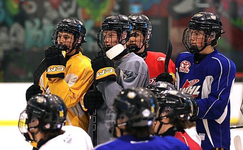 Under-18 AAA Brandon Wheat Kings players, from left to right, Jaxson Brick, Cole Dupuis, Nolan Saunderson and Konner MacKay, listen as a drill is explained by coaches during practice at J&amp;G Homes Arena earlier this week. (Perry Bergson/The Brandon Sun)
Sept. 27, 2024
