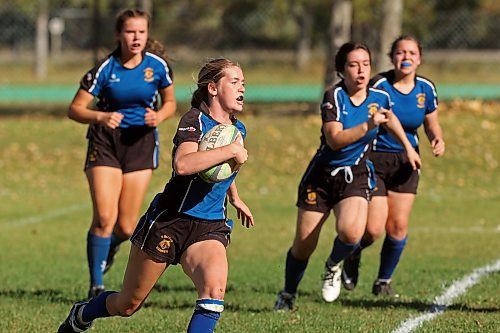 TOP LEFT: Aubrey Skelton with the Souris Sabres runs the ball during rugby 7’s action against the Vincent Massey Vikings JV at the Crocus 7’s Jamboree at Crocus Plains Regional Secondary School on Thursday. (Tim Smith/The Brandon Sun) 