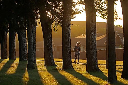 26092024
A jogger makes their way along the pathway beside the Brandon Municipal Cemetery at sunrise on a warm Thursday morning. 
Tim Smith/The Brandon Sun) 