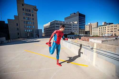 MIKAELA MACKENZIE / FREE PRESS
	
Josh Pchajek, a 22-year-old who bills himself as the Winnipeg Webhead, stretches before leaping into some classic poses on Wednesday, Sept. 25, 2024. For the last three years, Josh has been portraying Spider-Man at events all over the city.

For Dave Sanderson story.
Winnipeg Free Press 2024