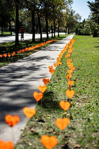 MIKAELA MACKENZIE / FREE PRESS
	
The orange heart walkway project at cole Van Walleghem School Thursday, Sept. 26, 2024. 

For Maggie story.
Winnipeg Free Press 2024