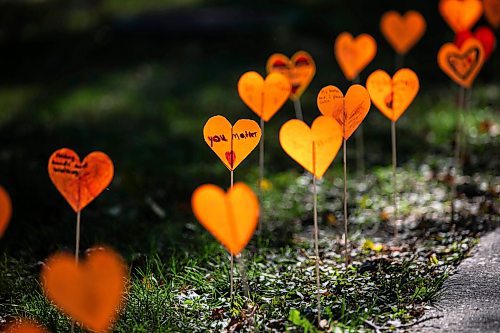 MIKAELA MACKENZIE / FREE PRESS
	
The orange heart walkway project at cole Van Walleghem School Thursday, Sept. 26, 2024. 

For Maggie story.
Winnipeg Free Press 2024