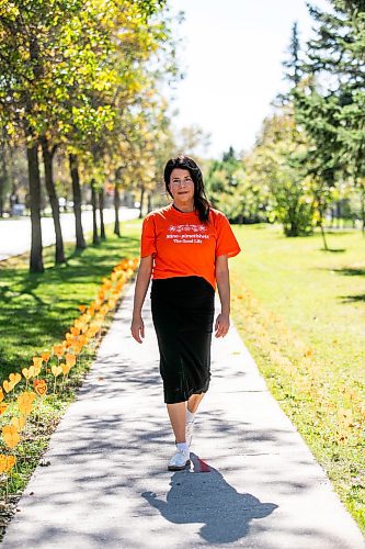 MIKAELA MACKENZIE / FREE PRESS
	
Teacher-librarian Suzanne Beauregard at cole Van Walleghem School Thursday, Sept. 26, 2024. Beauregard helped put together the orange heart walkway project at the school.

For Maggie story.
Winnipeg Free Press 2024