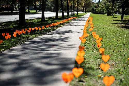 MIKAELA MACKENZIE / FREE PRESS
	
The orange heart walkway project at cole Van Walleghem School Thursday, Sept. 26, 2024. 

For Maggie story.
Winnipeg Free Press 2024