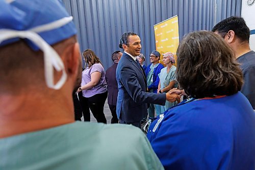 MIKE DEAL / FREE PRESS
Premier Wab Kinew is greeted by health care staff at the Grace Hospital as he arrives for a media event Thursday afternoon.
Premier Wab Kinew along with Health, Seniors and Long-Term Care Minister Uzoma Asagwara announce at a media event held at the Grace Hospital, that the Manitoba government is over halfway to its goal of hiring 1,000 net new health-care workers, Thursday afternoon.
Reporter: Chris Kitching
240926 - Thursday, September 26, 2024.