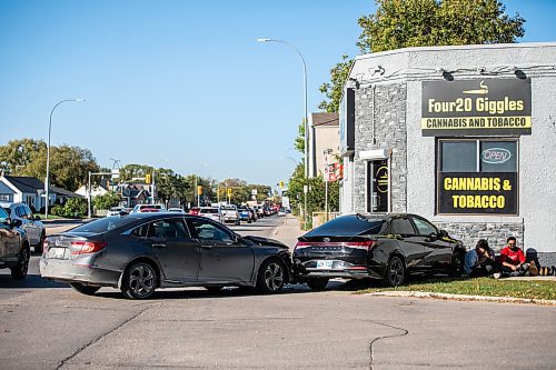 MIKAELA MACKENZIE / FREE PRESS
	
Two vehicles damaged in a collision outside of 420 Giggles at 713 McPhillips Street on Thursday, Sept. 26, 2024.

Winnipeg Free Press 2024