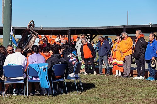 Verna Shannacappo looks down the line of survivors of residential schools who are being honoured by a drum circle song at Rolling River First Nation powwow grounds on Friday. Rolling River held an event for Truth and Reconciliation day, with hundreds of students from local schools and dignitaries. (Connor McDowell/Brandon Sun) 