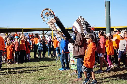 Chief Wilfred McKay Jr. leads students and dignitaries on a march around Rolling River First Nation powwow grounds on Friday. The band held a Truth and Reconciliation Day event for local school divisions and community members. (Connor McDowell/Brandon Sun)