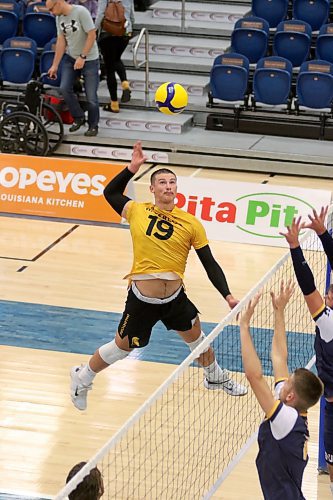 Brandonite Owen Paddock Thiessen attacks for the Waterloo Warriors against his hometown Bobcats during their men's volleyball pre-season tournament at the Healthy Living Centre on Friday. (Thomas Friesen/The Brandon Sun)