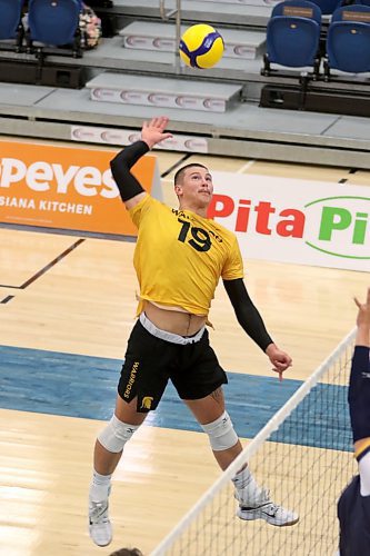 Brandonite Owen Paddock Thiessen attacks for the Waterloo Warriors against his hometown Bobcats during their men's volleyball pre-season tournament at the Healthy Living Centre on Friday. (Thomas Friesen/The Brandon Sun)