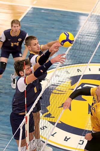 Bobcats JJ Love, left, and Philipp Lauter team up to block a Waterloo attack. (Thomas Friesen/The Brandon Sun)