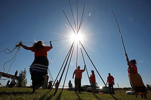 Volunteers work together to set up tipis during the community tipi raising and teachings at the Riverbank Discovery Centre on the first day of Truth and Reconciliation Week 2024 on Friday. (Tim Smith/The Brandon Sun)