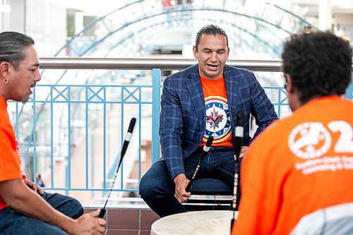 MIKAELA MACKENZIE / FREE PRESS
	
Premier Wab Kinew drums and sings with the Anishinaabe Voice Singers after a federal funding announcement at Portage Place on Friday, Sept. 27, 2024.

For Joyanne Story.
Winnipeg Free Press 2024