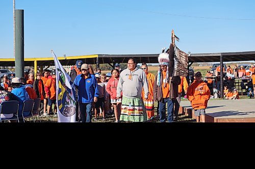 Chief Wilfred McKay Jr. (right) leads students and dignitaries on a march around the powwow grounds at Rolling River First Nations. The band held a day for Truth and Reconciliation on Friday. (Connor McDowell/Brandon Sun)