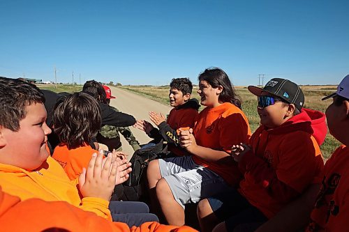 27092024
Students from Erickson Collegiate sing while taking a wagon ride during the Truth and Reconciliation Week 2024 event at Rolling River First Nation on Friday. 
(Tim Smith/The Brandon Sun)