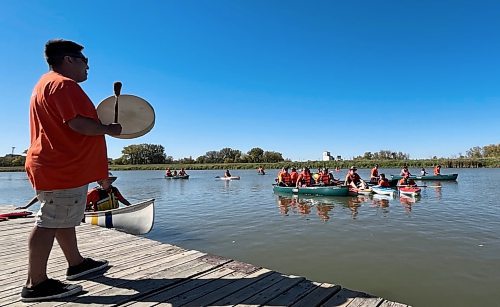 An Indigenous drummer sends the paddlers off on their Pulling Together voyage on Saturday from Dinsdale Park to the Riverbank Discovery Centre on the Assiniboine River. The event was hosted by Brandon Police Service, Brandon Urban Aboriginal Peoples Council and Truth and Reconciliation Week Committee. The sixteen canoes and kayaks were part of the numerous activities held to mark the National Day for Truth and Reconciliation. (Michele McDougall/The Brandon Sun)