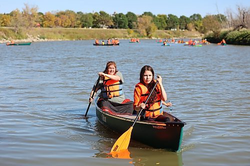 Canoeists paddle down the Assiniboine River from Dinsdale Park to the Riverbank Discovery Centre on Saturday in the annual Pulling Together voyage hosted by Brandon Police Service, Brandon Urban Aboriginal Peoples Council and Truth and Reconciliation Week Committee, to mark the National Day for Truth and Reconciliation. (Michele McDougall/The Brandon Sun)