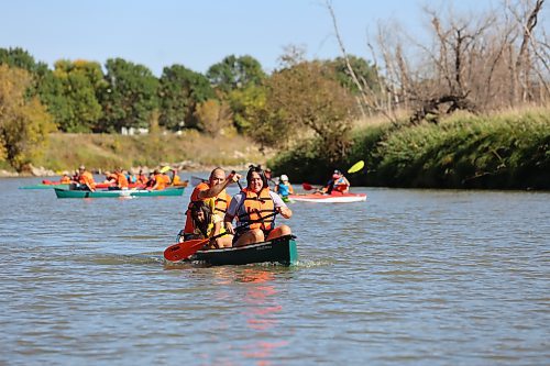 Canoeists paddle down the Assiniboine River from Dinsdale Park to the Riverbank Discovery Centre on Saturday in the annual Pulling Together voyage hosted by Brandon Police Service, Brandon Urban Aboriginal Peoples Council and Truth and Reconciliation Week Committee, to mark the National Day for Truth and Reconciliation. (Michele McDougall/The Brandon Sun)