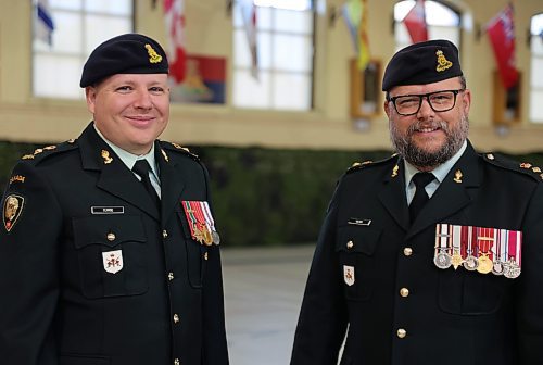 Lieutenant-Colonel Christopher Terrio (left), the new commanding officer of the 38 Artillery Tactical Group reservists stands beside out-going commander Lieutenant-Colonel Mark Wilson during the change of command ceremony, Sunday morning at the Brandon Armoury. (Michele McDougall/The Brandon Sun)  