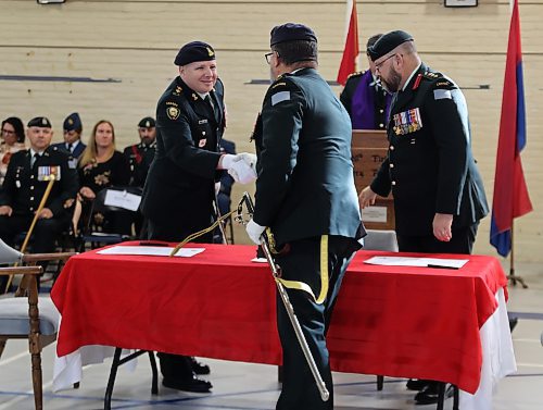 Lieutenant-Colonel Christopher Terrio (left), the new commanding officer of the 38 Artillery Tactical Group reservists shakes hands with out-going commander Lieutenant-Colonel Mark Wilson during the change of command ceremony, Sunday morning at the Brandon Armoury. (Michele McDougall/The Brandon Sun)