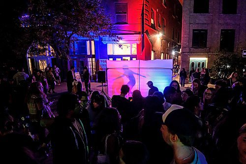 Mike Sudoma/Free Press
Ludochroma II is a returning exhibit which mixes lights, music and interpretive dance. Festival goers watch as musicians and dancer perform behind translucent white sheets resulting in music and colour shining through the streets of Albert St
Sept 28, 2024
