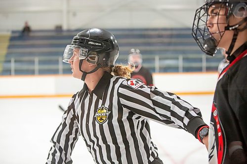 BROOK JONES / FREE PRESS
Hockey Manitoba linesperson Ally Wareham who is a female keeps opposing players apart at the end of the game between the St. James Jr. Canucks and the visiting Charleswood Hawks in a Manitoba Major Junior Hockey League action at the Ab McDonald Arena in Winnipeg, Man., Friday, Sept. 27, 2024.