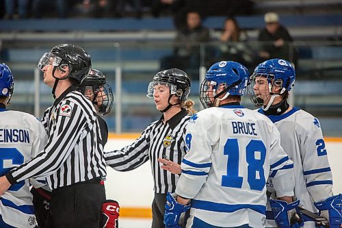 BROOK JONES / FREE PRESS
Hockey Manitoba linesperson Ally Wareham (middle) who is a female and fellow linesperson Ryley Livingston keep opposing players apart after a whistle during first period action between the St. James Jr. Canucks and the visiting Charleswood Hawks in a Manitoba Major Junior Hockey League game at the Ab McDonald Arena in Winnipeg, Man., Friday, Sept. 27, 2024.