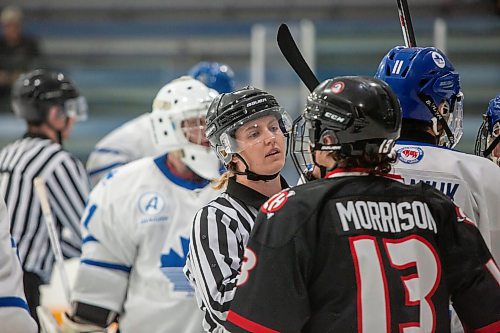 BROOK JONES / FREE PRESS
Hockey Manitoba linesperson Ally Wareham who is a female keeps opposing players apart after a whistle during first period action between the St. James Jr. Canucks and the visiting Charleswood Hawks in a Manitoba Major Junior Hockey League game at the Ab McDonald Arena in Winnipeg, Man., Friday, Sept. 27, 2024.