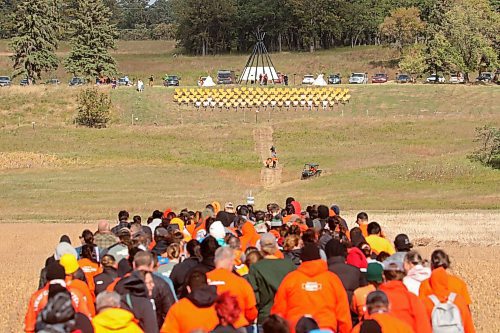 30092024
Participants make their way from Grand Valley Road across a field to the former Brandon Residential School site during the Truth and Reconciliation Week 2024 Orange Shirt Day Walk on Monday. The walk began and ended at the Riverbank Discovery Centre grounds with speeches, teaching and ceremony at the former Brandon Residential School site. (Tim Smith/The Brandon Sun)