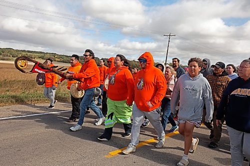 30092024
Frederick Wood carries the Brandon Friendship Centre Eagle Staff while leading participants to the former Brandon Residential School site during the Truth and Reconciliation Week 2024 Orange Shirt Day Walk on Monday. (Tim Smith/The Brandon Sun)