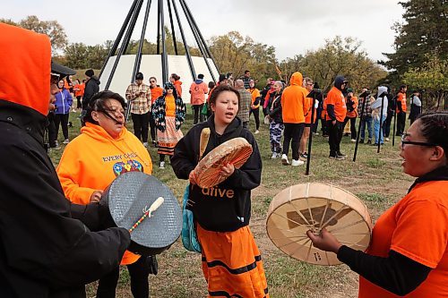 30092024
Drummers Sam Jackson, Lori Carver, Iyana Spence and Brianna Hunt perform a song at the former Brandon Residential School site during the Truth and Reconciliation Week 2024 Orange Shirt Day Walk on Monday. Orange Shirt Day brings attention and education to the ongoing impacts of the Residential School system. (Tim Smith/The Brandon Sun)