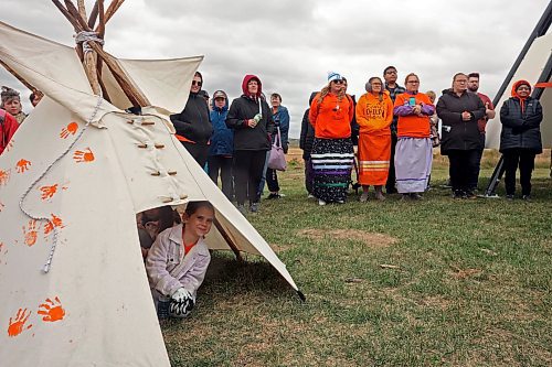 30092024
Participants listen to speakers at the former Brandon Residential School site during the Truth and Reconciliation Week 2024 Orange Shirt Day Walk on Monday. The walk began and ended at the Riverbank Discovery Centre grounds with speeches, teaching and ceremony at the former Brandon Residential School site. (Tim Smith/The Brandon Sun)