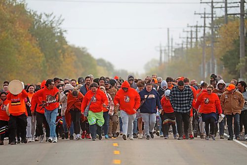 30092024
Participants make their way along Grand Valley Road to the former Brandon Residential School site during the Truth and Reconciliation Week 2024 Orange Shirt Day Walk on Monday. The walk began and ended at the Riverbank Discovery Centre grounds with speeches, teaching and ceremony at the former Brandon Residential School site. (Tim Smith/The Brandon Sun)