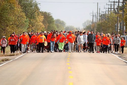 30092024
Participants make their way along Grand Valley Road to the former Brandon Residential School site during the Truth and Reconciliation Week 2024 Orange Shirt Day Walk on Monday. The walk began and ended at the Riverbank Discovery Centre grounds with speeches, teaching and ceremony at the former Brandon Residential School site. (Tim Smith/The Brandon Sun)