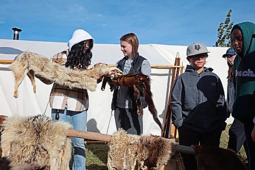 01102024
April Guintu and Natalie Noto with Assiniboine College&#x2019;s Social Service Worker program look over furs belonging to M&#xe9;tis educators Grant and Hazel Armstrong while visiting the Truth and Reconciliation Week 2024 events at the Riverbank Discovery Centre grounds on Tuesday. 
(Tim Smith/The Brandon Sun)