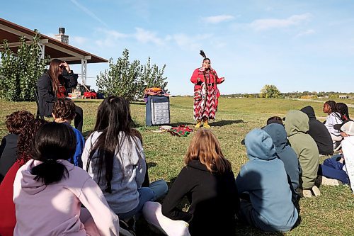 01102024
Kennedy Playford of Cranberry Portage speaks to students about her jingle dress and other items important to her culture during educational programming for students at Truth and Reconciliation Week 2024 at the Riverbank Discovery Centre grounds on Tuesday. Programming for area students continues until Thursday. 
(Tim Smith/The Brandon Sun)