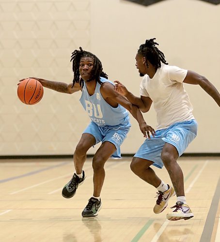 Jakarri Lindsey dribbles while fellow import guard Dewayne Thompson defends during BU men's basketball practice at Henry Champ Gymnasium on Wednesday. (Thomas Friesen/The Brandon Sun)