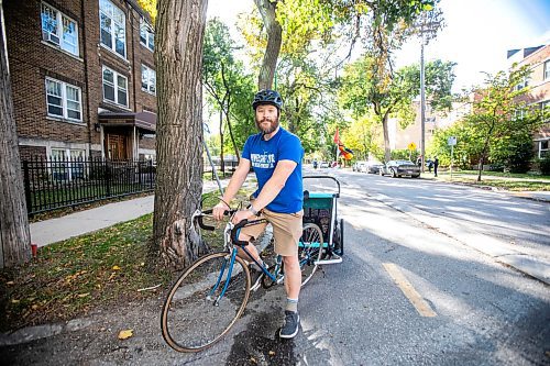 MIKAELA MACKENZIE / FREE PRESS
	
Andrew Kohan in the bike lane along Assiniboine Avenue (near where a moving vehicle recently blocked the route) on Wednesday, Oct. 2, 2024. While parking in bike lanes is illegal, it isn&#x574; often ticketed.

For Malak story.
Winnipeg Free Press 2024