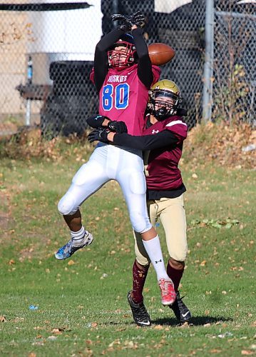 Crocus Plainsmen Erik Solomon, right, breaks up a pass intended for Sturgeon Heights Huskies star receiver Truson Joyal during their Winnipeg High School Football League game at Crocus on Thursday. (Thomas Friesen/The Brandon Sun)