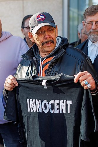 MIKE DEAL / FREE PRESS
Clarence Woodhouse holds up a t-shirt that says &#x201c;Innocent&#x201d; on it to the media as he leaves court with family and his lawyers after being acquitted and declared innocent of the killing that took place in Winnipeg in 1973.
Reporter: Katrina Clarke
241003 - Thursday, October 03, 2024.