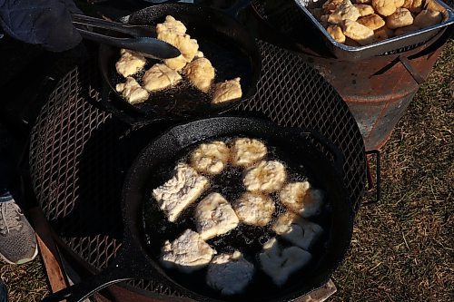 03102024
Amanda Dupuis, Community Housing and Wellness Programmer with the City of Brandon, cooks bannock for students taking part in Truth and Reconciliation Week 2024 programming at the Riverbank Discovery Centre grounds on Thursday. Today is the final day of Truth and Reconciliation Week with events including the Sisters in Spirit Petal Ceremony at Dinsdale Park, Healing by the River at the Discovery Centre as well as closing ceremonies and a feast.
(Tim Smith/The Brandon Sun)