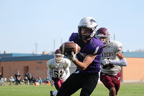 Logan Van Santen catches a pass for the Vikings as Vinay Gupta lines up a hit. (Thomas Friesen/The Brandon Sun)