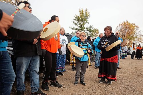 04102024
Nine-year-old Frasier McArthur of &#xc9;cole New Era School takes part in drumming and singing during the Sisters In Spirit petal ceremony in honour and remembrance of missing and murdered indigenous women and girls at Dinsdale Park on Friday morning.  
(Tim Smith/The Brandon Sun)